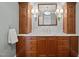 Elegant bathroom vanity with marble countertop, wooden cabinets, and stylish lighting fixtures at 2035 Stuart Ct, Burlington, NC 27215