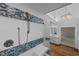 Stylish bathroom featuring a walk-in shower and a view into the vanity area, all with modern fixtures at 2035 Stuart Ct, Burlington, NC 27215
