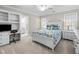 Bright bedroom with a built-in desk and adjacent bathroom at 2035 Stuart Ct, Burlington, NC 27215