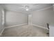Spacious bedroom with a ceiling fan and neutral carpet and ensuite access at 2035 Stuart Ct, Burlington, NC 27215