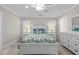 Serene bedroom with white wooden bed frame and coastal bedding at 2035 Stuart Ct, Burlington, NC 27215