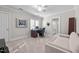 Home office with built-in desk, comfortable couch, and adjacent bathroom at 2035 Stuart Ct, Burlington, NC 27215
