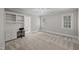 Well lit bedroom featuring an ensuite bathroom, study nook with built in desk and two windows at 2035 Stuart Ct, Burlington, NC 27215