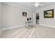 Spacious bedroom with a work desk, and access to a small bathroom at 2035 Stuart Ct, Burlington, NC 27215