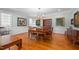 Bright dining room featuring hardwood floors and a large table at 2035 Stuart Ct, Burlington, NC 27215
