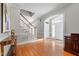Elegant entryway with hardwood floors, staircase, and access to other rooms at 2035 Stuart Ct, Burlington, NC 27215