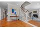 Grand entryway with hardwood floors, staircase, and a console table at 2035 Stuart Ct, Burlington, NC 27215