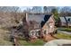 Charming brick home featuring well-manicured landscaping and a welcoming front entrance at 2035 Stuart Ct, Burlington, NC 27215