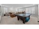 Game room with pool table, seating area, and built-in cabinetry at 2035 Stuart Ct, Burlington, NC 27215