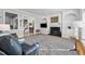 Gathering room with built-in shelving, fireplace, and hardwood floors at 2035 Stuart Ct, Burlington, NC 27215