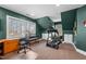 Spacious home gym with a treadmill and office area at 2035 Stuart Ct, Burlington, NC 27215