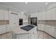 Well-equipped kitchen with modern appliances, granite countertops, and ample storage in white cabinetry at 2035 Stuart Ct, Burlington, NC 27215