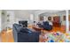 Bright living room with hardwood floors, fireplace, and a formal dining area at 2035 Stuart Ct, Burlington, NC 27215