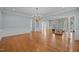 Expansive living room with hardwood floors, chandelier, and seamless flow into other living spaces at 2035 Stuart Ct, Burlington, NC 27215
