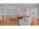 Bright, airy living room with hardwood floors, elegant columns, and comfortable seating arrangement at 2035 Stuart Ct, Burlington, NC 27215