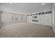 Large entertainment room with built-in storage and shelving units, offering ample space for media and décor at 2035 Stuart Ct, Burlington, NC 27215
