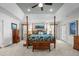 Spacious main bedroom with a post bed, ample natural light, and hardwood floors at 2035 Stuart Ct, Burlington, NC 27215