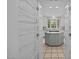 Spacious walk-in pantry with wire shelving, connecting to the kitchen with stainless steel appliances at 2035 Stuart Ct, Burlington, NC 27215