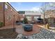 Brick patio with fire pit, seating, and a relaxing atmosphere at 2035 Stuart Ct, Burlington, NC 27215