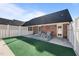 Private patio with artificial turf and seating at 2035 Stuart Ct, Burlington, NC 27215
