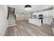 Open concept living space integrates the kitchen and living room, featuring modern finishes and wood floors at 2115 Titanium Rock Road Rd, Durham, NC 27704