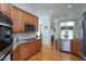 Modern kitchen with stainless steel appliances and granite countertops at 2328 Carriage Oaks Dr, Raleigh, NC 27614