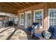 Brick patio with seating area and access to backyard at 2328 Carriage Oaks Dr, Raleigh, NC 27614