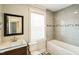Clean bathroom featuring a tub, toilet, and updated vanity at 2400 Dorety Pl, Raleigh, NC 27604