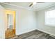 Bedroom features wood-look flooring and an open doorway to another room at 2400 Dorety Pl, Raleigh, NC 27604