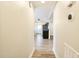 Long hallway with light walls and wood-look flooring at 2400 Dorety Pl, Raleigh, NC 27604