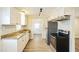 Updated kitchen featuring white cabinets and granite countertops at 2400 Dorety Pl, Raleigh, NC 27604