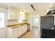 Renovated kitchen with granite countertops and stainless steel appliances at 2400 Dorety Pl, Raleigh, NC 27604