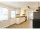White kitchen cabinets, granite countertops, and stainless steel appliances at 2400 Dorety Pl, Raleigh, NC 27604