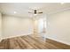 Open living room with hardwood floors and access to other rooms at 2400 Dorety Pl, Raleigh, NC 27604