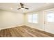 Bright living room with hardwood floors and ceiling fan at 2400 Dorety Pl, Raleigh, NC 27604