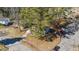 Aerial view of neighborhood home, trees, and road at 2400 Keith Dr, Raleigh, NC 27610