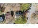 Birds eye view of neighborhood homes with mature trees and black roof at 2400 Keith Dr, Raleigh, NC 27610