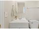Cozy bathroom featuring a white vanity, a modern mirror, and simple, clean fixtures at 2400 Keith Dr, Raleigh, NC 27610