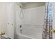 Bathtub and shower combination with a shower curtain and door at 2400 Keith Dr, Raleigh, NC 27610