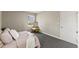 Sunlit bedroom with a window view, a comfortable chair, and stylish decor at 2400 Keith Dr, Raleigh, NC 27610