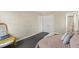 Cozy bedroom featuring neutral walls, plush carpeting, and ample closet space at 2400 Keith Dr, Raleigh, NC 27610