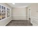 Dining room with window views and wood look flooring at 2400 Keith Dr, Raleigh, NC 27610