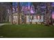 Charming single-story home with beautiful landscaping and red shutters at 2400 Keith Dr, Raleigh, NC 27610