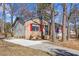 This lovely single-story home features mixed siding, updated windows, and a large concrete driveway at 2400 Keith Dr, Raleigh, NC 27610