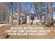 Charming single-story home featuring a brick facade, bright red shutters, and mature trees at 2400 Keith Dr, Raleigh, NC 27610