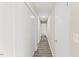 Hallway with a view of multiple doors and a flush mount light at 2400 Keith Dr, Raleigh, NC 27610