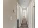 Hallway view showcasing the wood-look flooring and neutral paint colors at 2400 Keith Dr, Raleigh, NC 27610