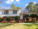 Charming two-story home featuring a well-maintained lawn and mature landscaping at 2509 Foxgate Dr, Raleigh, NC 27610
