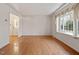 Bright living room features hardwood flooring, a large window, and an open layout at 2509 Foxgate Dr, Raleigh, NC 27610