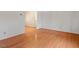 Living area showcasing hardwood floors, neutral walls, and views into other rooms at 2509 Foxgate Dr, Raleigh, NC 27610